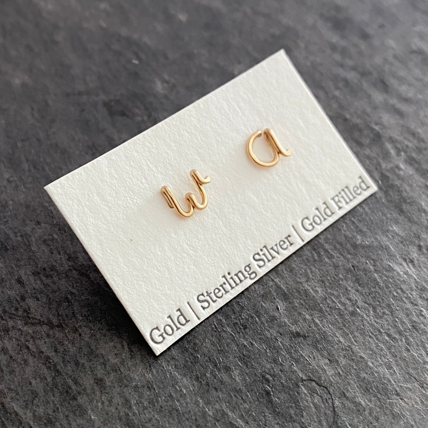 14k Gold Pair of Initial Earrings. Small Dainty lowercase script earrings. Gold Letter Wire Studs.