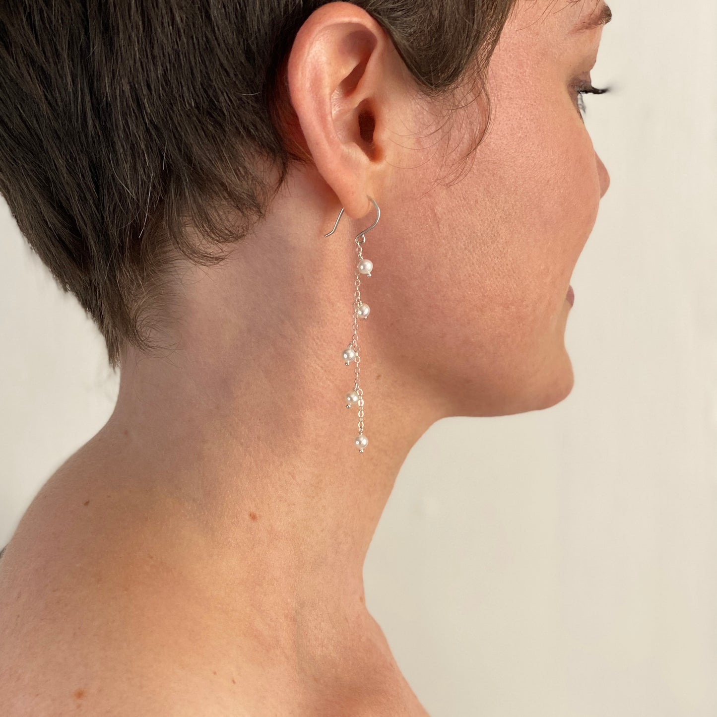 White Pearl Earrings. Chain dangle pearl earrings. Sterling Silver or 14k Gold Wire. Small freshwater pearl bridal earrings.