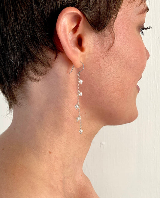 White Pearl Earrings. Chain dangle pearl earrings. Sterling Silver or 14k Gold Wire. Small freshwater pearl bridal earrings.