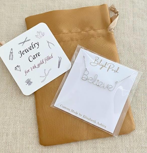 Sterling Silver Believe Necklace: Script Wire Word Pendant