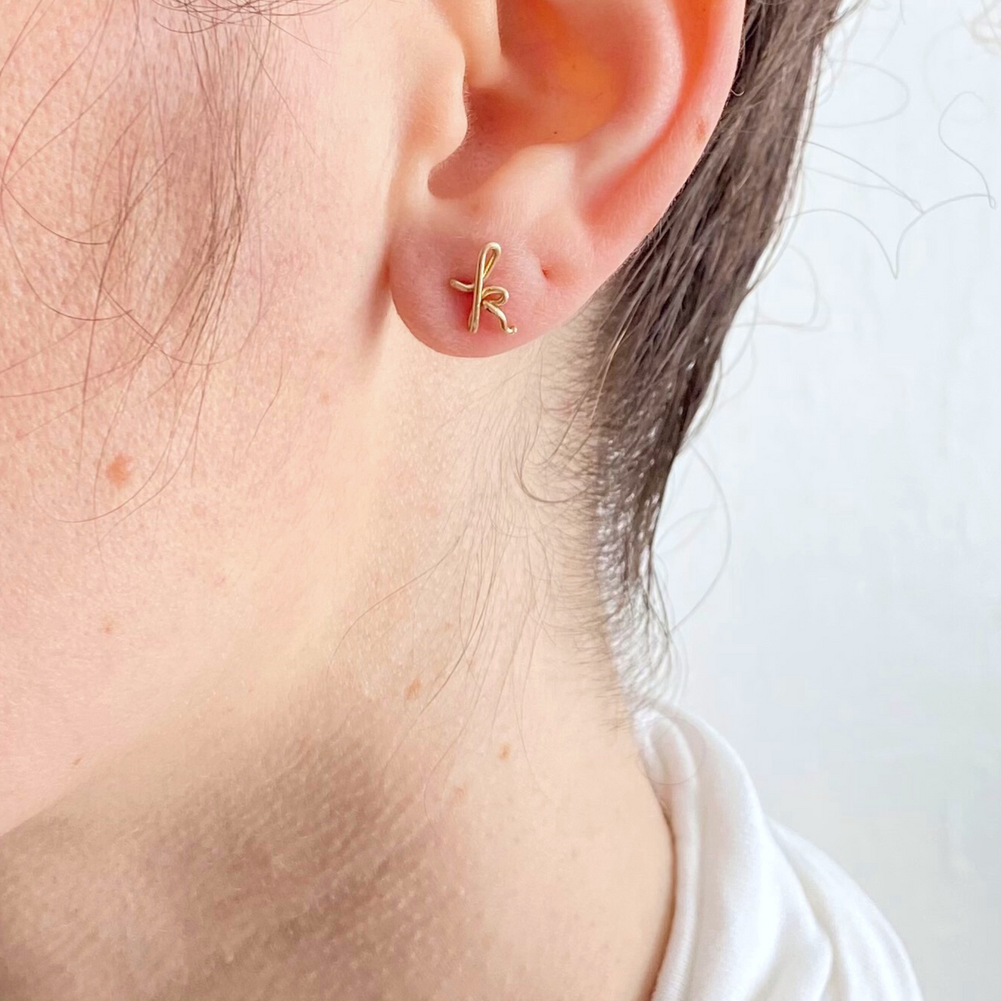 14k Gold Pair of Initial Earrings. Small Dainty lowercase script earrings. Gold Letter Wire Studs.