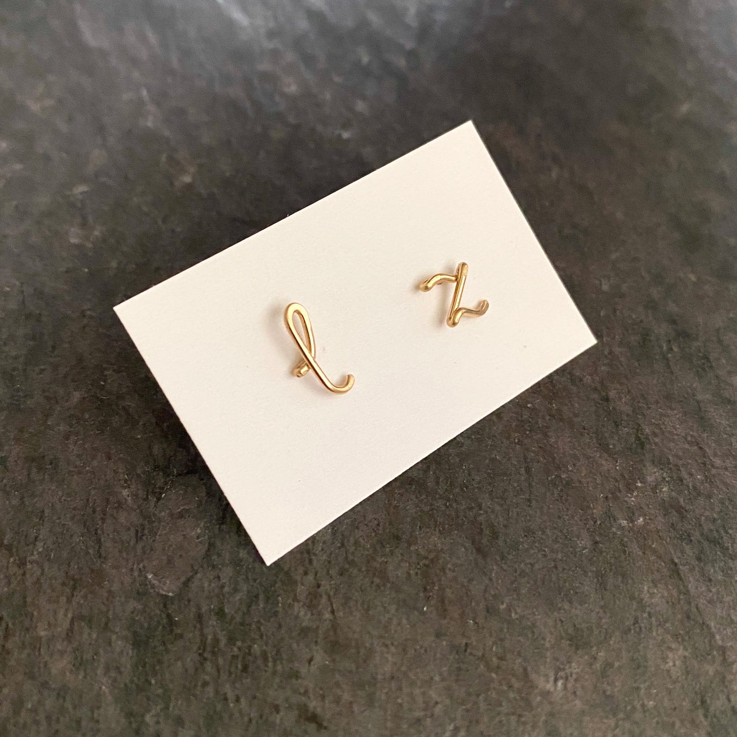 14k Gold Pair of Initial Earrings. Small Dainty lowercase script earrings. Gold Letter Wire Studs.