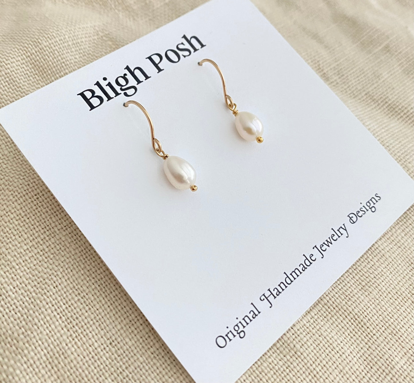 Freshwater Pearl Drop Earrings: Luxe Off White Oval Luminous Pearl Earrings