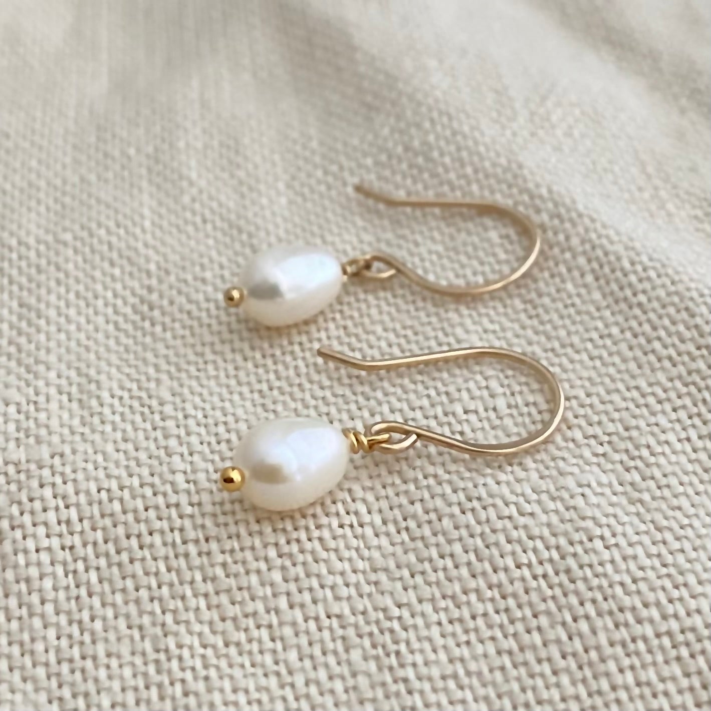 Freshwater Pearl Drop Earrings: Luxe Off White Oval Luminous Pearl Earrings