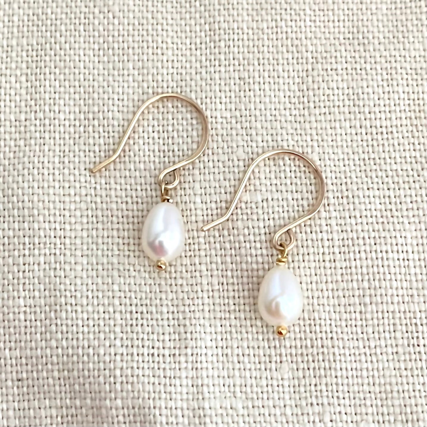 Freshwater Pearl Drop Earrings: Luxe Off White Oval Luminous Pearl Earrings