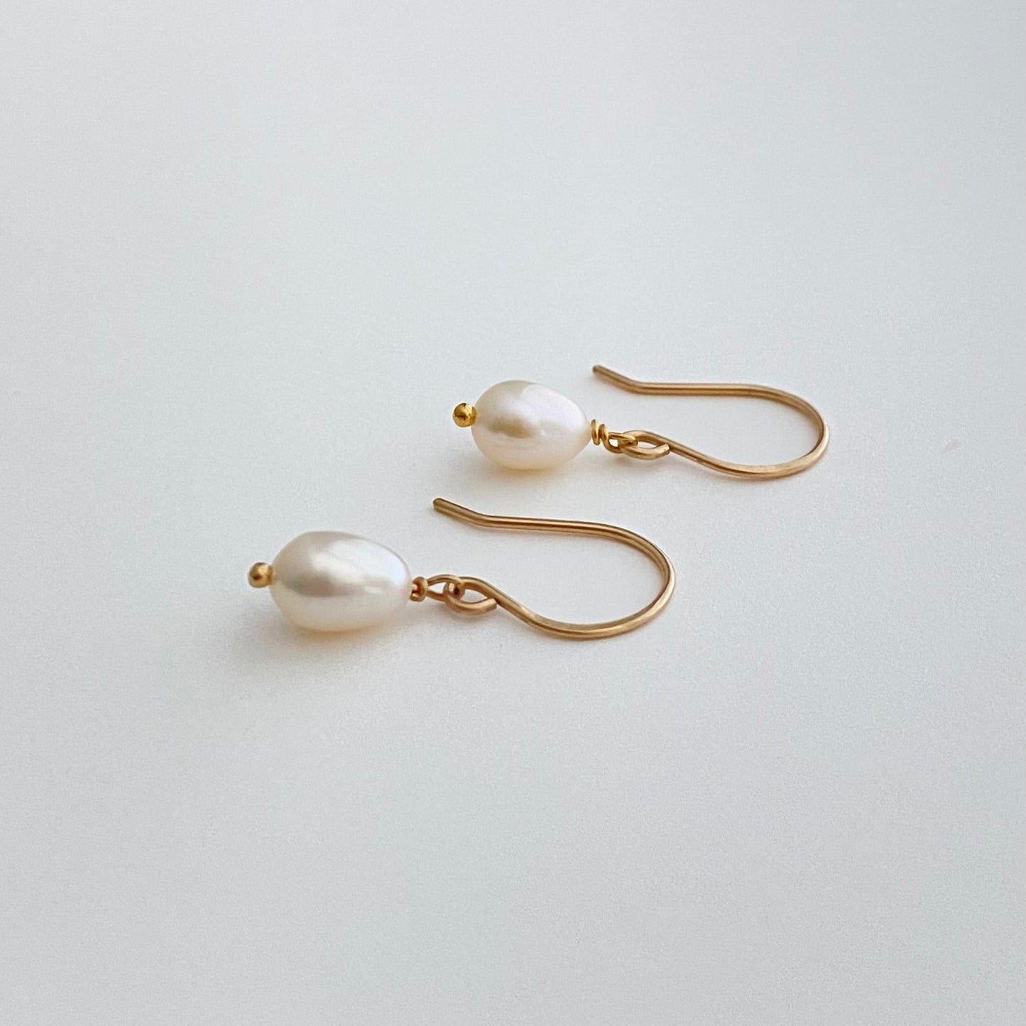 Freshwater Pearl Drop Earrings: Luxe Off White Oval Luminous Pearl Earrings